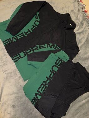 Supreme Black Track Pants with Red Size Tag